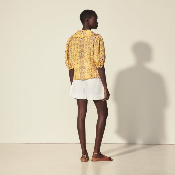 Blusa estampada de cuello amplio
